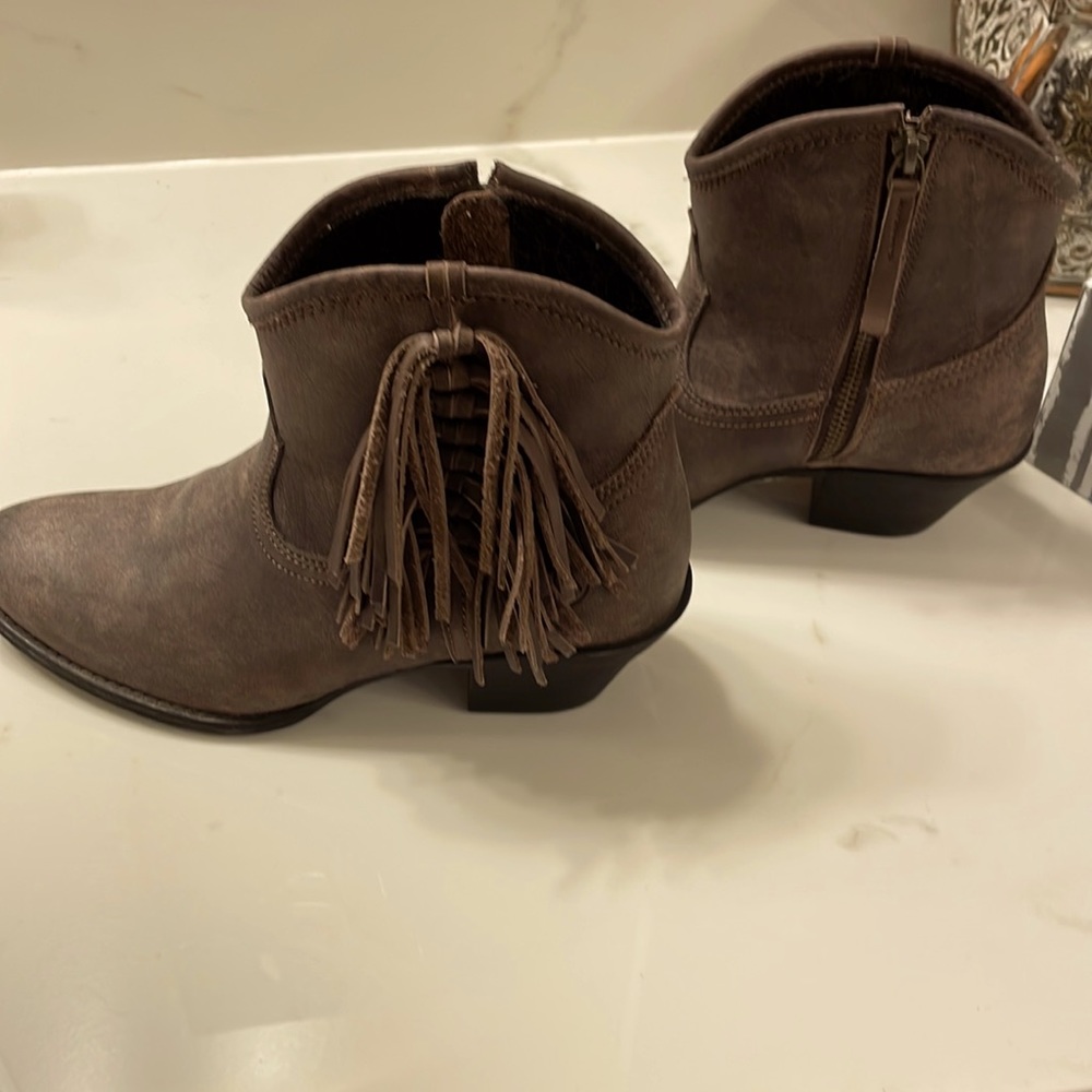 Brown booties with fringe on the side.  Super cute!  Great condition